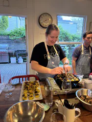Mallory cooking mini coconut pancakes