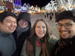 Kellen, Brady, Mallory, and Tynor on a street in a Bavarian town
